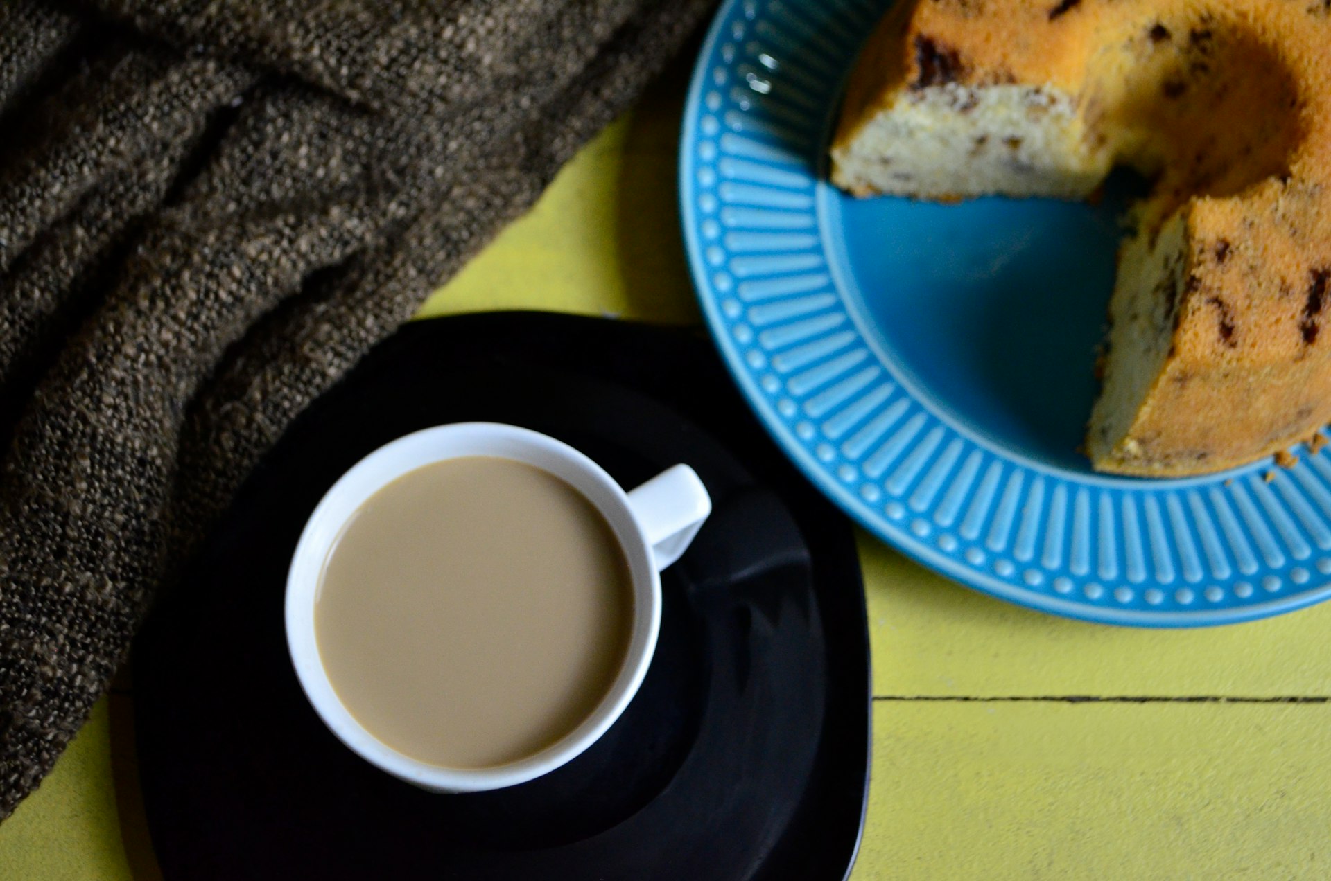 white ceramic mug on blue round plate